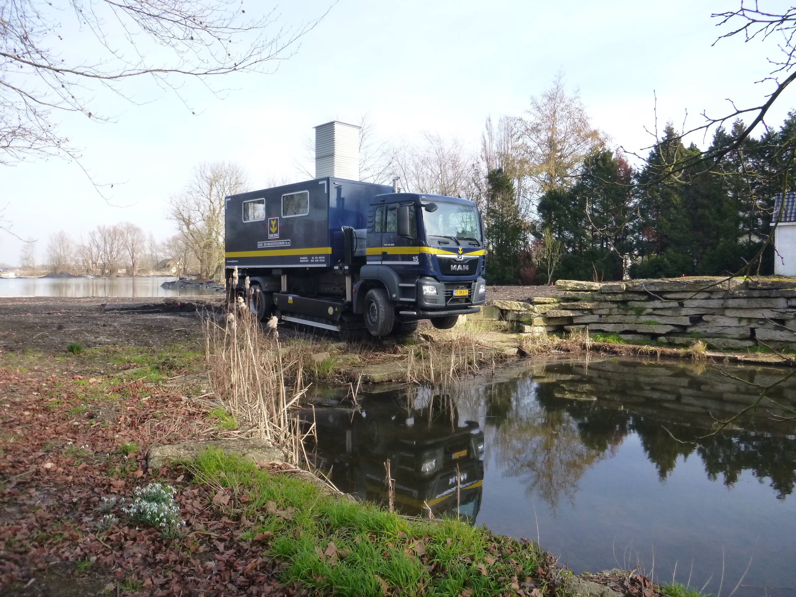 Van Dijk Geotechniek's Track-Truck conducts CPTs near water.